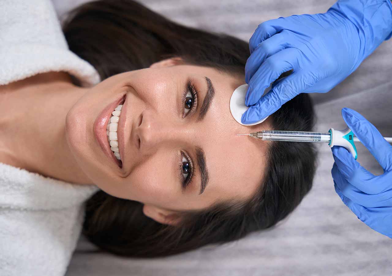 Forehead Lines 3 botox syringe enjection woman forehead