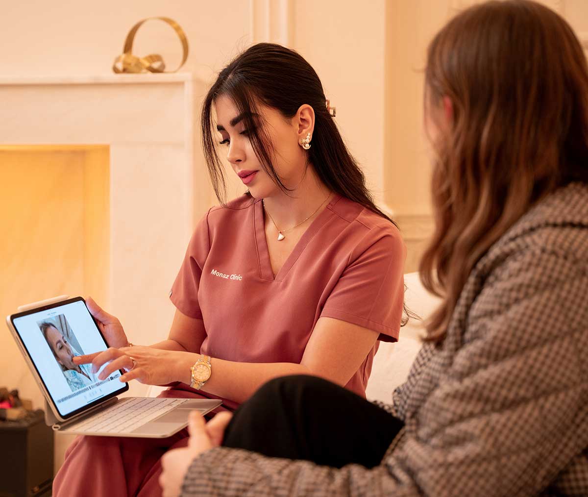 Gummy Smile Correction 3 Specialist explaining anti-wrinkle injections for gummy smile correction during consultation at Monaz Clinic