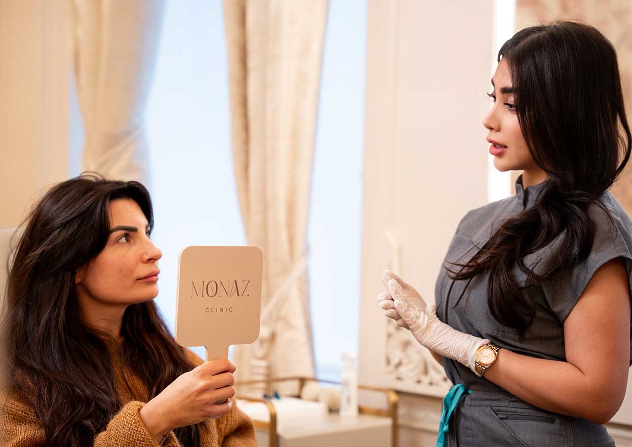 Patient discussing transparent pricing and flexible aesthetic treatment options during consultation at Monaz Clinic.