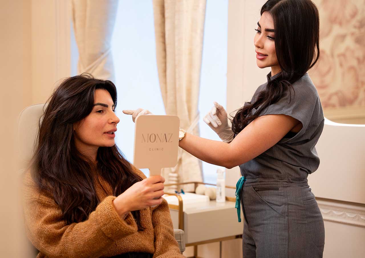 Visual facial mapping and personalised treatment planning during a medical aesthetics consultation at Monaz Clinic.